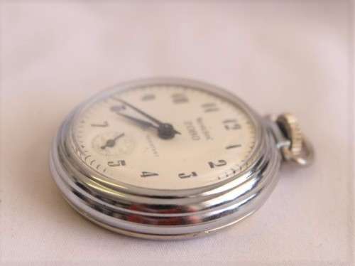 A gorgeous antique Canadian made Westclox Zobo chrome plated open-face pocket watch with a fob chain