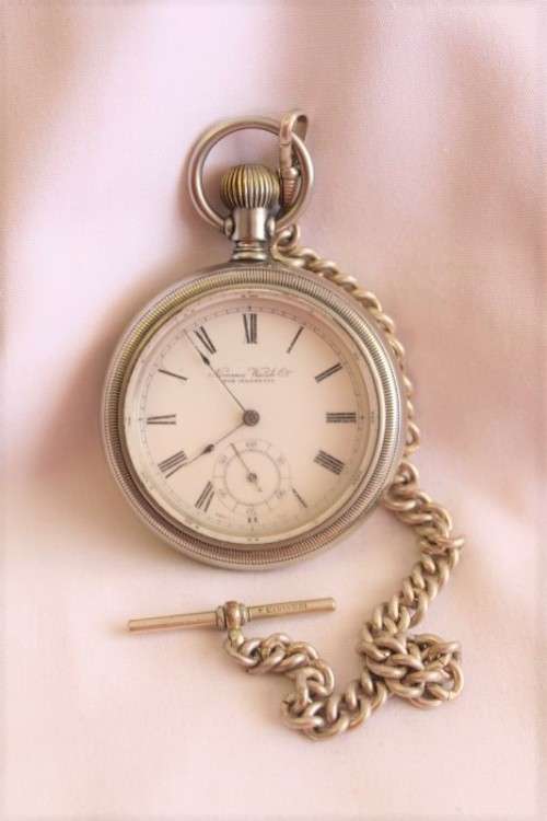 An awesome Swiss made silver plated 7-Jewel enamel face Nirvana pocket watch and fob chain