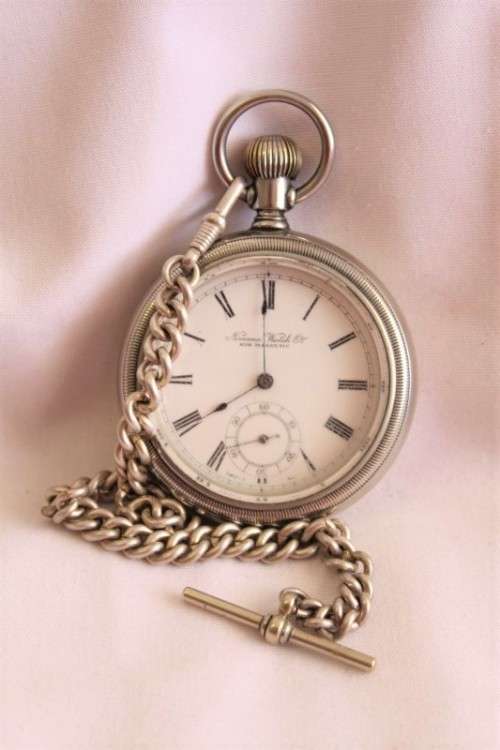 An awesome Swiss made silver plated 7-Jewel enamel face Nirvana pocket watch and fob chain