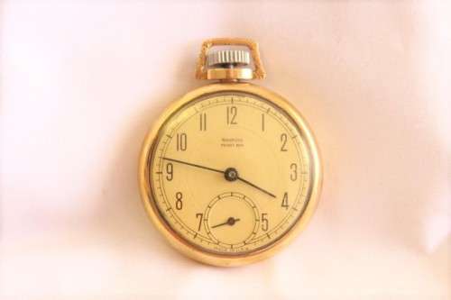 An awesome USA made Westclox Pocket Ben gold plated open-face pocket watch with a fob chain