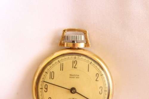 An awesome USA made Westclox Pocket Ben gold plated open-face pocket watch with a fob chain