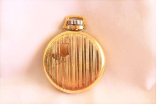 An awesome USA made Westclox Pocket Ben gold plated open-face pocket watch with a fob chain