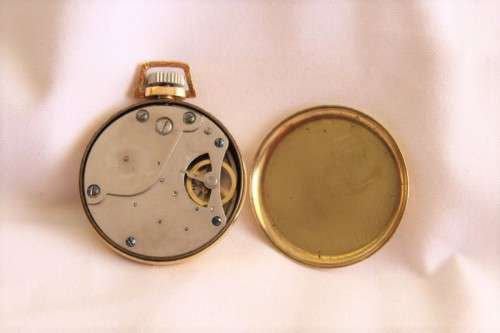 An awesome USA made Westclox Pocket Ben gold plated open-face pocket watch with a fob chain
