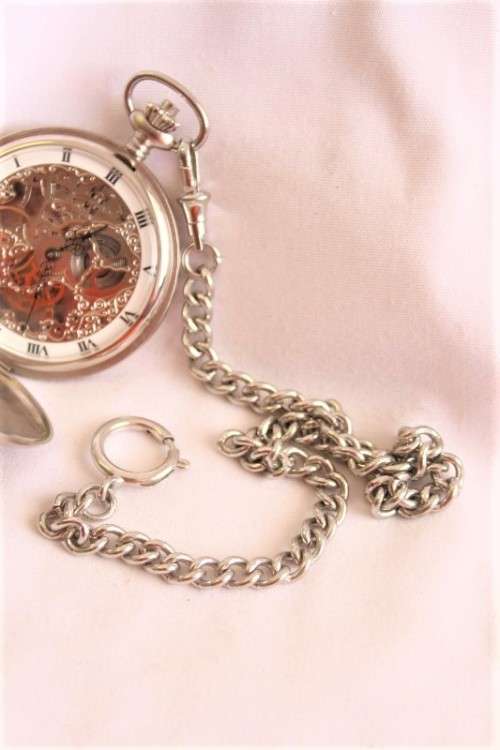 A stunning modern brushed steel Buren "skeleton" full hunter pocket watch with a fob chain