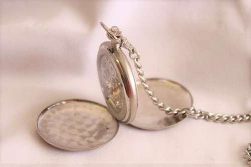 A stunning modern brushed steel Buren "skeleton" full hunter pocket watch with a fob chain