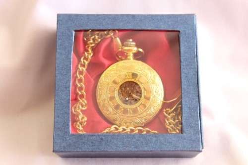 A stunning gold plated German made Kronen & Sohne pocket watch with a fob chain in its original box