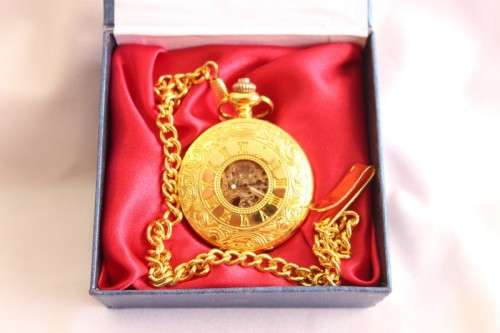 A stunning gold plated German made Kronen & Sohne pocket watch with a fob chain in its original box