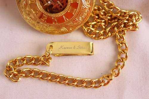 A stunning gold plated German made Kronen & Sohne pocket watch with a fob chain in its original box