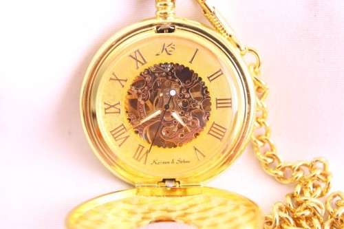 A stunning gold plated German made Kronen & Sohne pocket watch with a fob chain in its original box