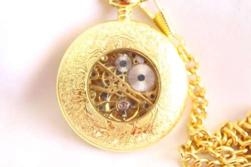A stunning gold plated German made Kronen & Sohne pocket watch with a fob chain in its original box