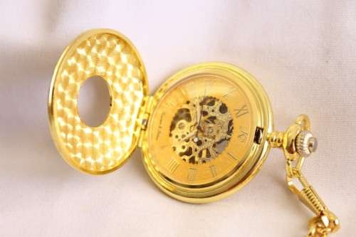 A stunning gold plated German made Kronen & Sohne pocket watch with a fob chain in its original box