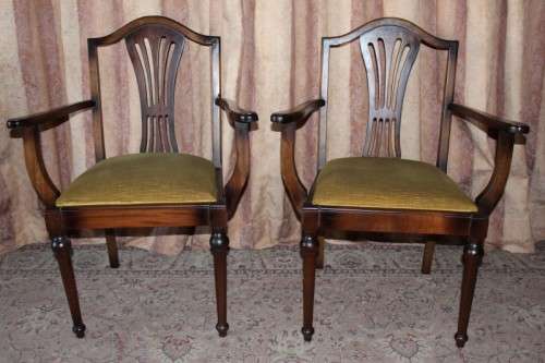 A beautiful solid Oak dining suite with a large extendible table and eight upholstered chairs.