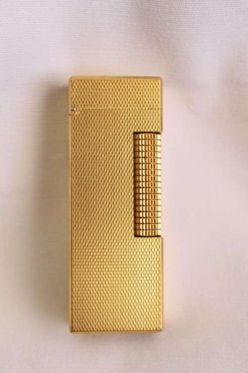 A beautiful vintage (c1972) gold plated Dunhill Rollagas lighter in its box in working condition