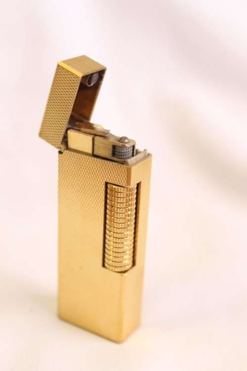 A beautiful vintage (c1972) gold plated Dunhill Rollagas lighter in its box in working condition