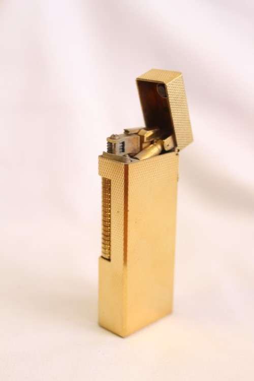 A beautiful vintage (c1972) gold plated Dunhill Rollagas lighter in its box in working condition