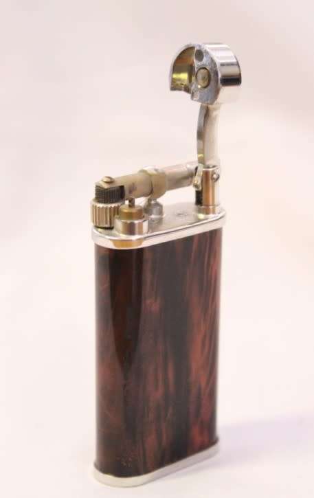 A stylish original (brown marble) Peterson pipe lighter in its original box in stunning condition