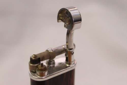 A stylish original (brown marble) Peterson pipe lighter in its original box in stunning condition