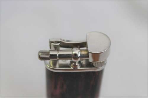 A stylish original (brown marble) Peterson pipe lighter in its original box in stunning condition
