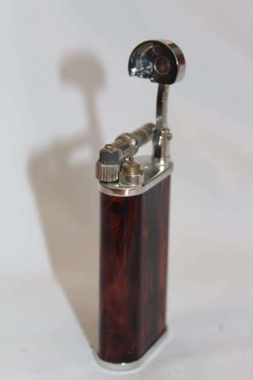 A stylish original (brown marble) Peterson pipe lighter in its original box in stunning condition