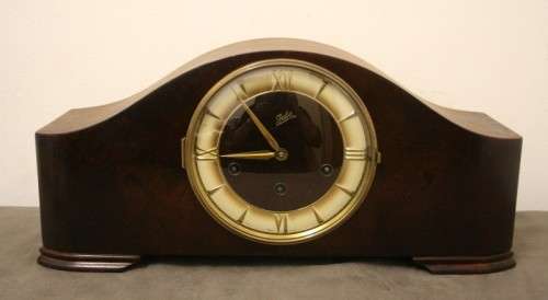A gorgeous German made Art deco style "Juba" wind up chiming mantle clock in working condition.