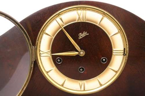A gorgeous German made Art deco style "Juba" wind up chiming mantle clock in working condition.
