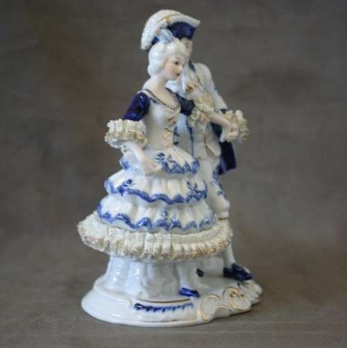 A beautiful blue and white porcelain figurine of a Victorian couple, fabulous on display.