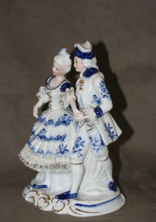 A beautiful blue and white porcelain figurine of a Victorian couple, fabulous on display.