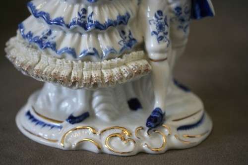 A beautiful blue and white porcelain figurine of a Victorian couple, fabulous on display.