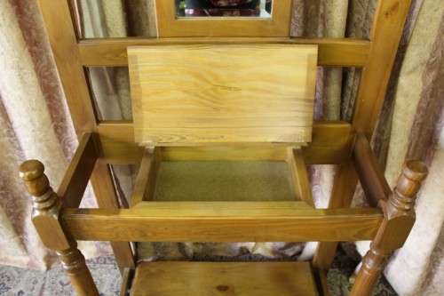 A gorgeous light wood hall stand with a coloured stained glass top, centre mirror and storage drawer