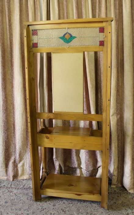 A gorgeous light wood hall stand with a coloured stained glass top, centre mirror and storage drawer