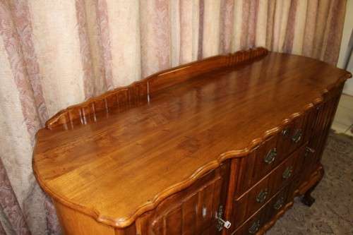 A fabulous vintage ball & claw buffet/ side server with beautiful styled doors and three drawers