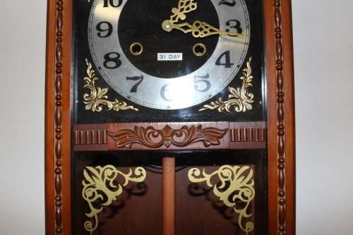 A beautiful, stylish vintage wall hanging "Blessings" 31 day wind up pendulum clock.