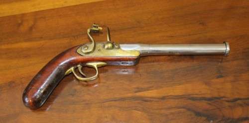 A fantastic wood with brass & metal embellishments vintage powder pistol. Awesome display piece!!!