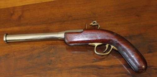 A fantastic wood with brass & metal embellishments vintage powder pistol. Awesome display piece!!!