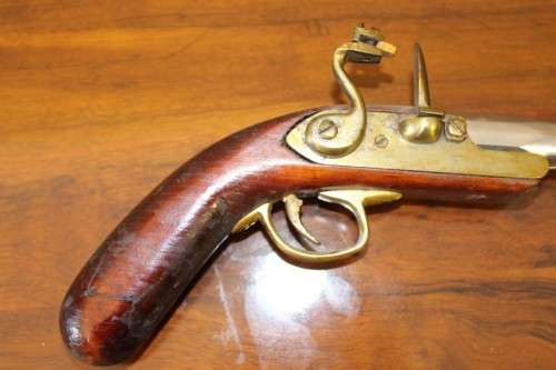 A fantastic wood with brass & metal embellishments vintage powder pistol. Awesome display piece!!!