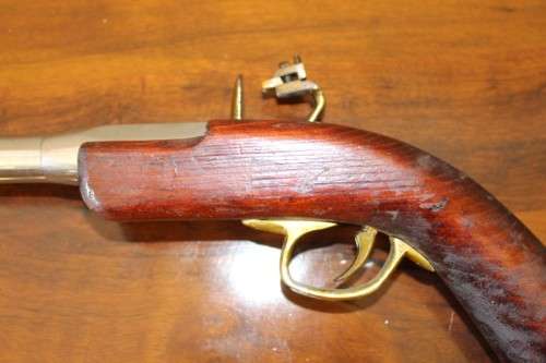A fantastic wood with brass & metal embellishments vintage powder pistol. Awesome display piece!!!
