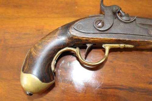 A fantastic wood with brass embellishments vintage powder pistol. Awesome display piece!!!