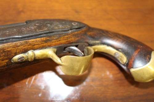 A fantastic wood with brass embellishments vintage powder pistol. Awesome display piece!!!