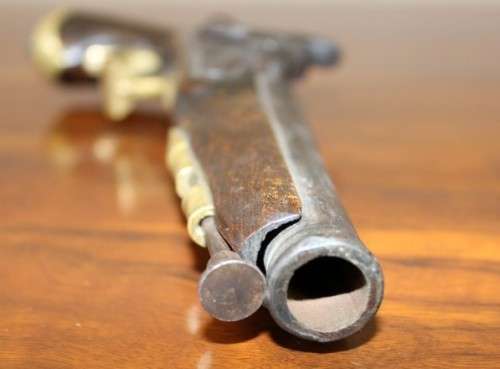 A fantastic wood with brass embellishments vintage powder pistol. Awesome display piece!!!