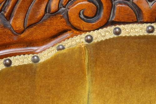 An elegant vintage Victorian styled carved arm chair w/ button detailing & gorgeous golden fabric.