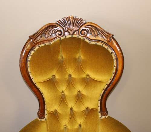 An elegant vintage Victorian styled carved arm chair w/ button detailing & gorgeous golden fabric.