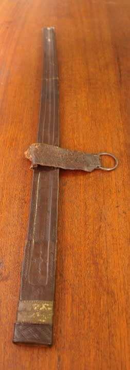 An incredible rare antique Takoba sword in its original leather sheath. Fantastic on display!!