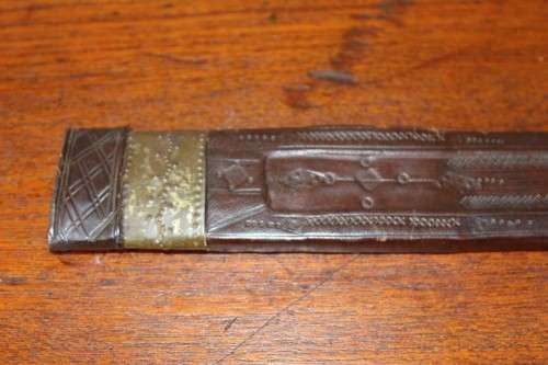 An incredible rare antique Takoba sword in its original leather sheath. Fantastic on display!!