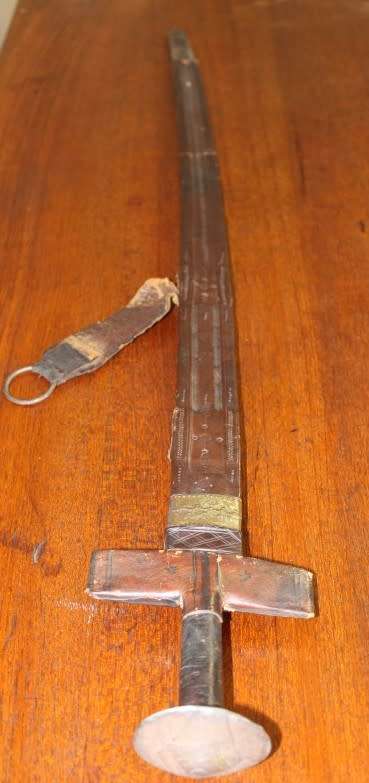 An incredible rare antique Takoba sword in its original leather sheath. Fantastic on display!!