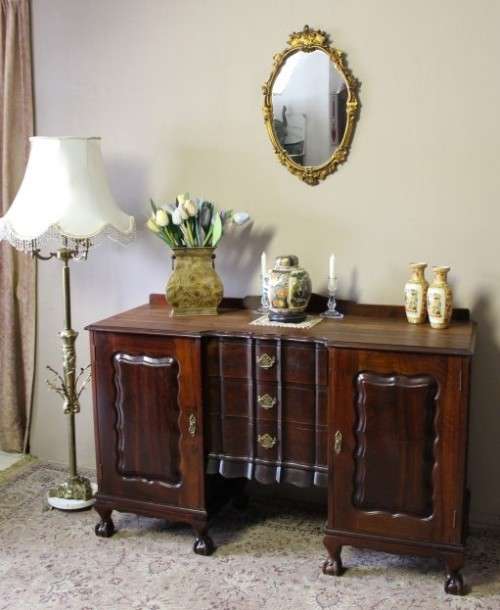 A fantastic vintage Imbuia ball & claw buffet/ side server w/ beautiful styled doors & three drawers
