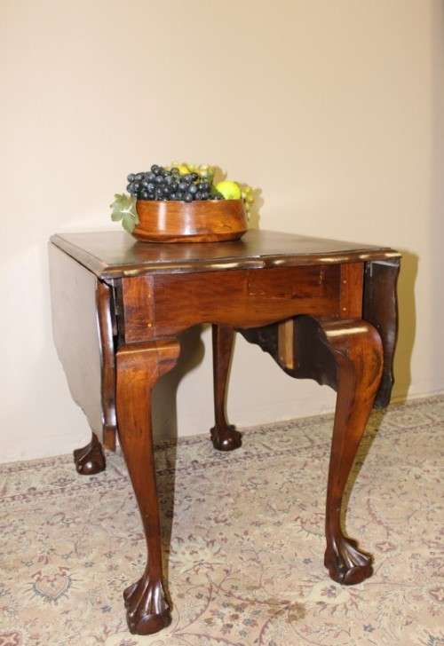 A fabulous stylish vintage drop leaf occasional table with oversized ball and claw feet. Stunning!!!
