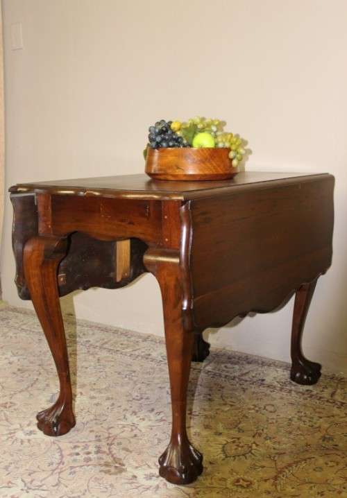 A fabulous stylish vintage drop leaf occasional table with oversized ball and claw feet. Stunning!!!