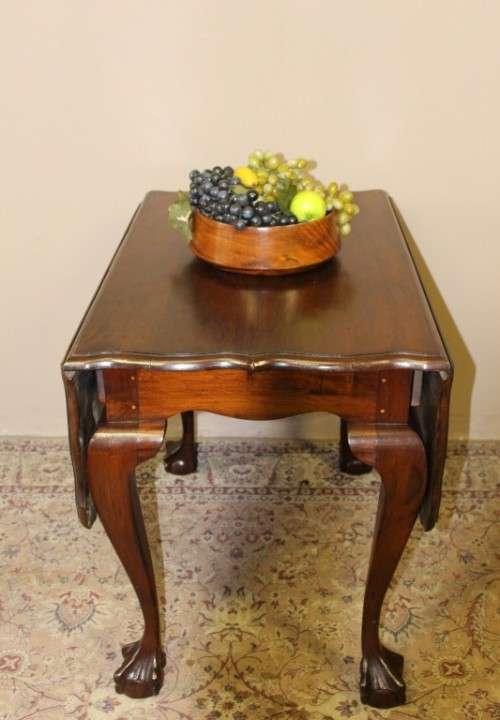 A fabulous stylish vintage drop leaf occasional table with oversized ball and claw feet. Stunning!!!