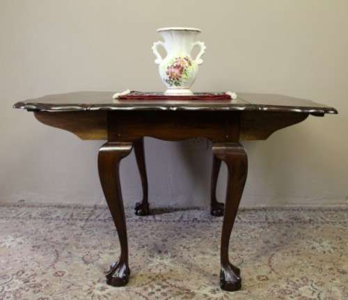 A fabulous stylish vintage drop leaf occasional table with oversized ball and claw feet. Stunning!!!