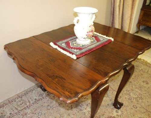 A fabulous stylish vintage drop leaf occasional table with oversized ball and claw feet. Stunning!!!
